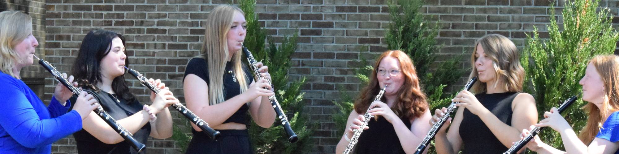 A group of GVSU oboists playing outside of HCPA.